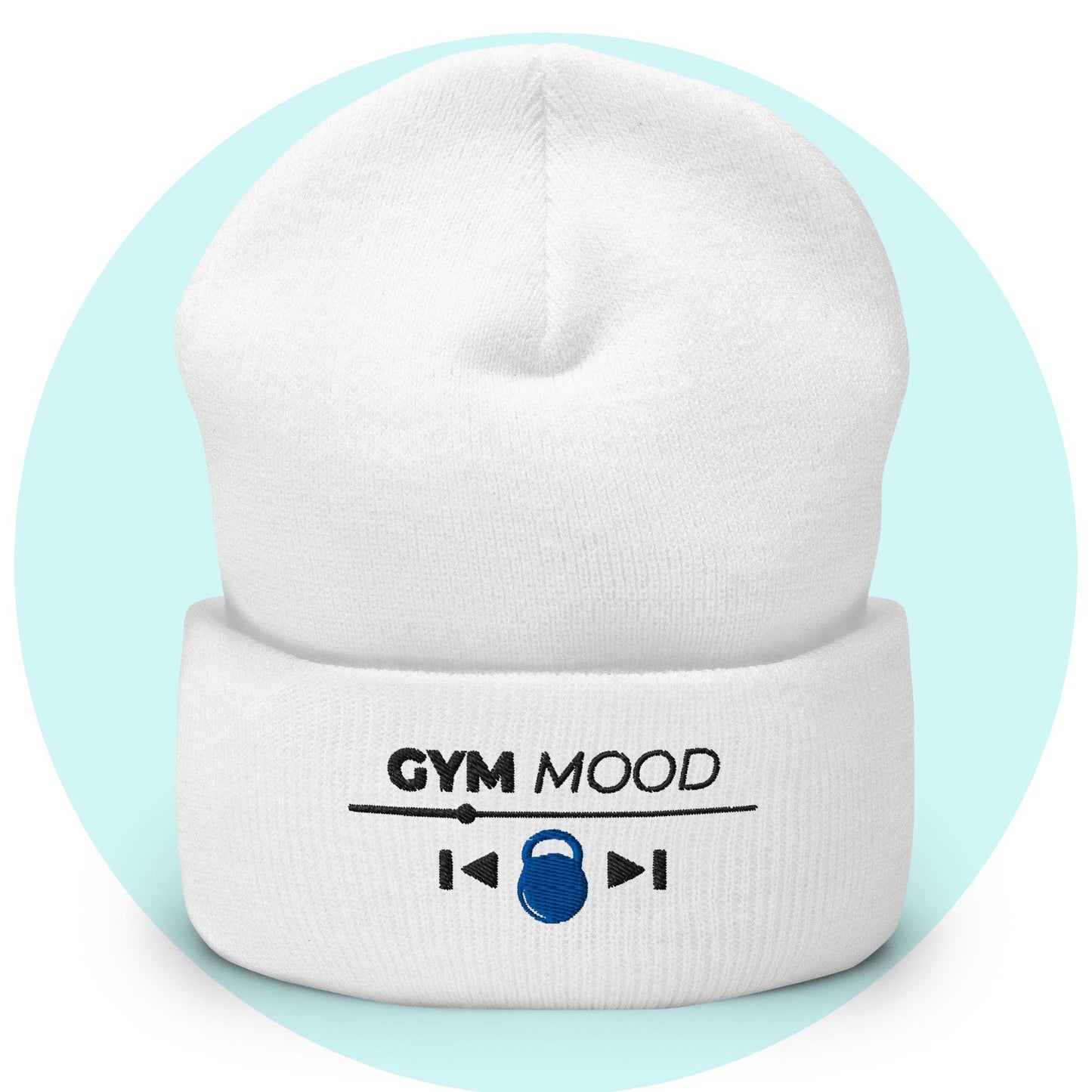 White cuffed beanie from the Gym Mood On collection with embroidered text and blue kettlebell icon, displayed on a light blue background.