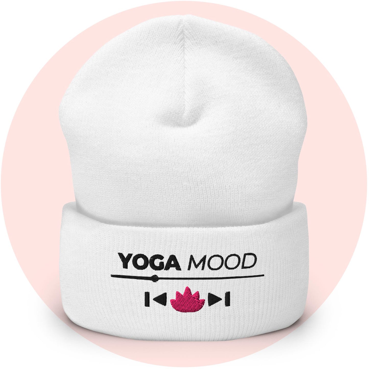 White cuffed beanie from the Yoga Mood On collection with embroidered text and pink lotus icon, displayed on a soft pink background.