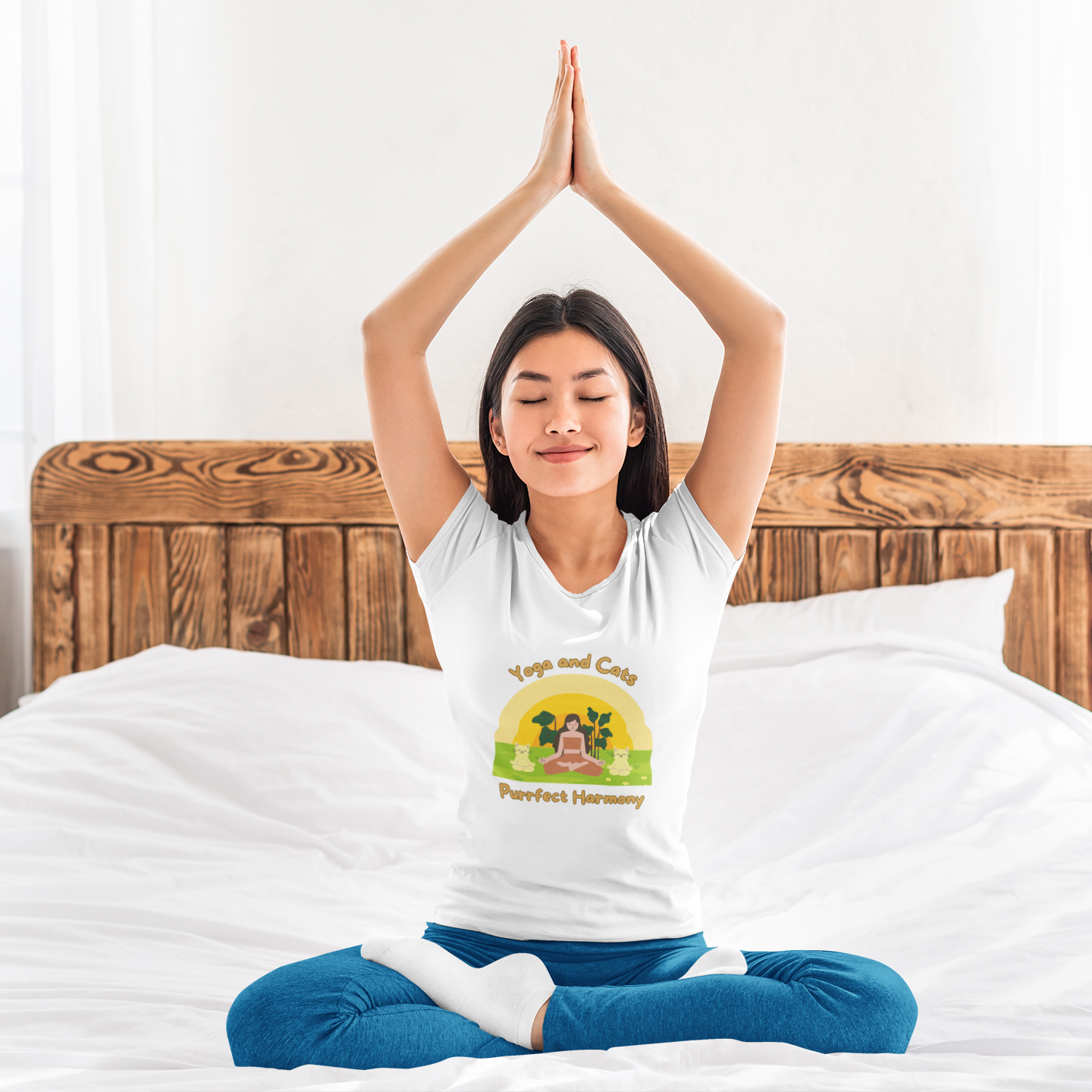 Woman in yoga pose wearing "Yoga and Cats Purrfect Harmony" white yoga t-shirt – mindfulness and cat-themed apparel