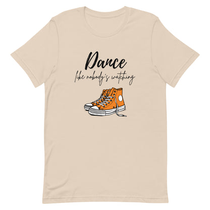 Soft cream unisex dance t-shirt with the phrase “Dance Like Nobody’s Watching”. A carefree and uplifting design for those who dance freely and unapologetically.