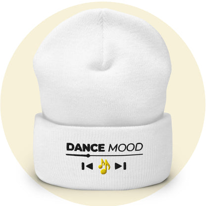 White cuffed beanie from the Dance Mood On collection with embroidered text and yellow music note icon, displayed on a light yellow background
