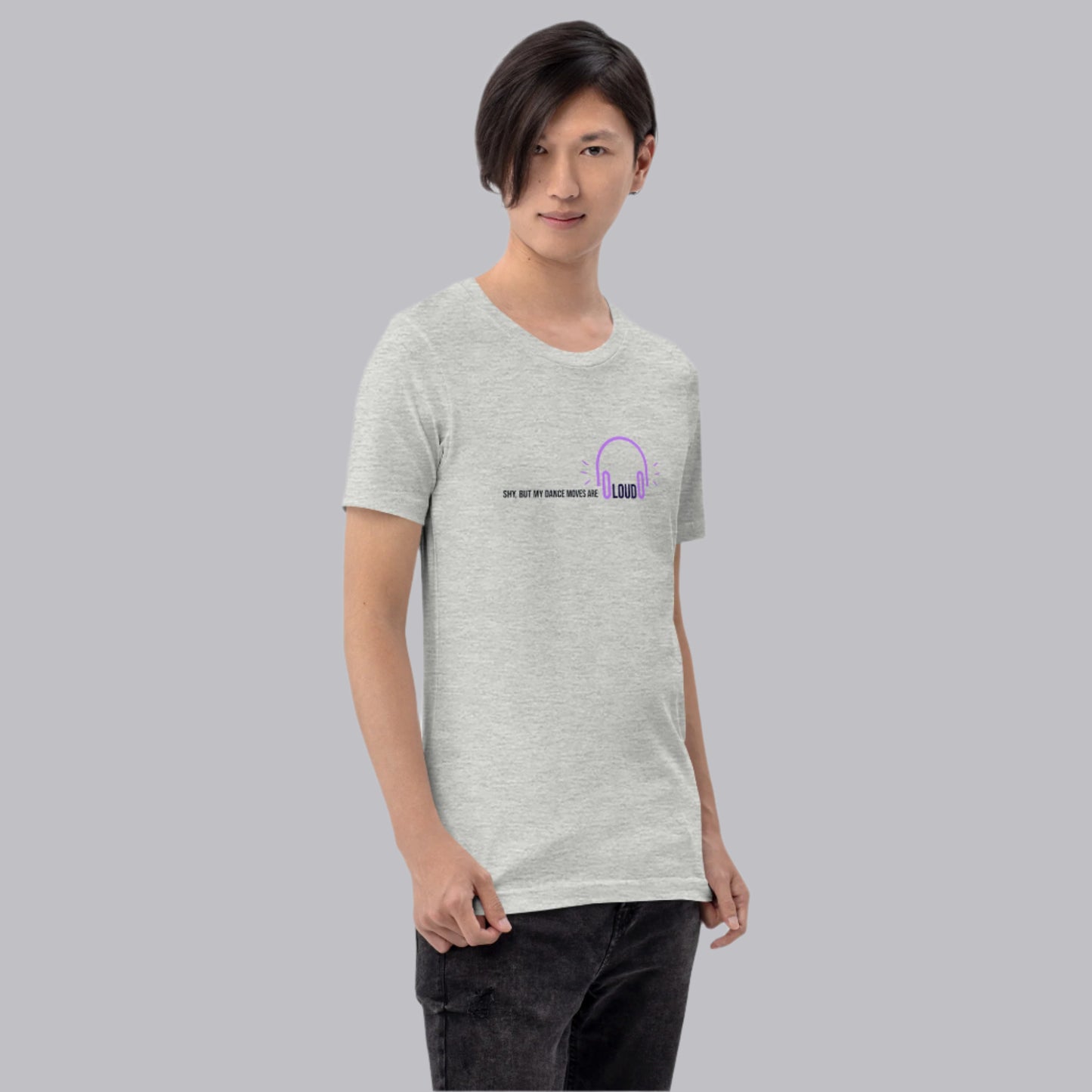 Man wearing grey unisex t-shirt with the phrase "Shy, But My Dance Moves Are Loud.” A fun and confident contrast of personality and performance, ideal for dancers who let their moves speak for them.