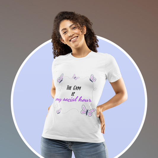 Woman wearing white unisex gym t-shirt with the phrase “The Gym is My Social Hour” in clean, bold font. 