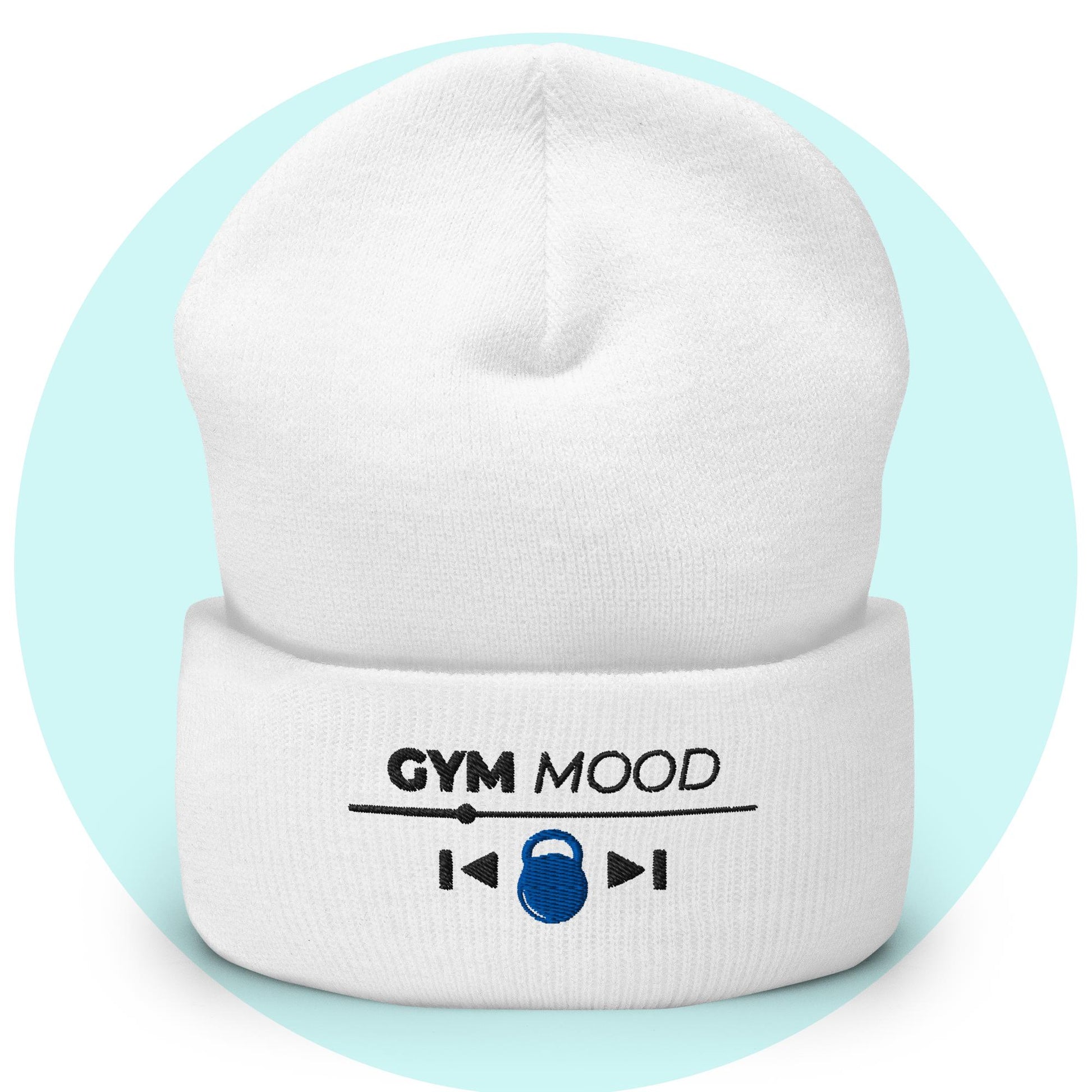 White cuffed beanie from the Gym Mood On collection with embroidered text and blue kettlebell icon, displayed on a light blue background.