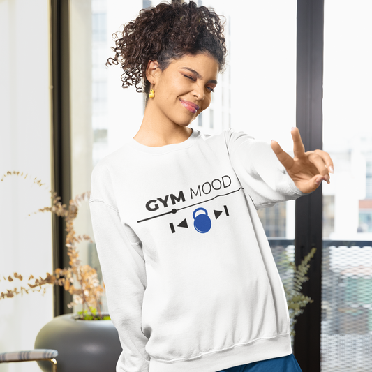 White unisex Gym Mood On sweatshirt featuring black text and blue kettlebell graphic, modeled by a woman in an indoor setting.