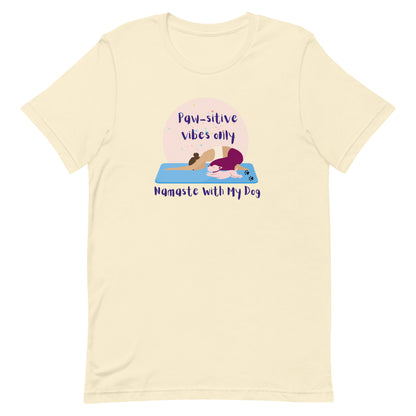 Front view of “Paw-sitive Vibes Only – Namaste with My Dog” unisex t-shirt in natural – cute yoga tee featuring a woman and dog stretching on yoga mats by MM Tee Lab.
