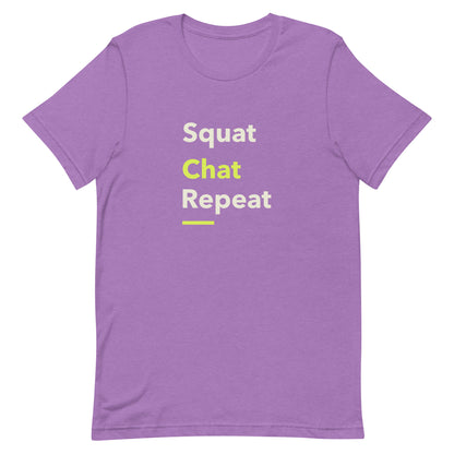 Heather team purple unisex gym t-shirt with the phrase “Squat Chat Repeat.” A cheeky and relatable gym-themed design for fitness lovers who mix reps with conversation.
