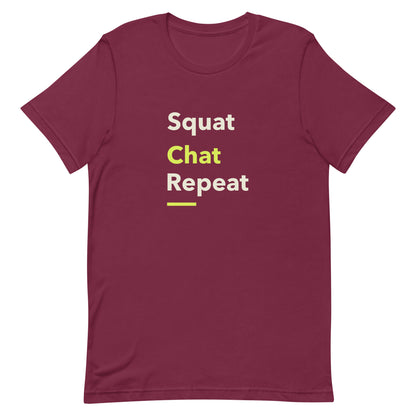 Maroon unisex gym t-shirt with the phrase “Squat Chat Repeat.” A cheeky and relatable gym-themed design for fitness lovers who mix reps with conversation.