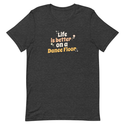 Dark grey heather unisex dance t-shirt with the phrase “Life Is Better on a Dance Floor” in bold, uplifting script. A feel-good design for anyone who finds joy, energy, and belonging through dance.