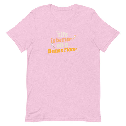 Heather prim lilac unisex dance t-shirt with the phrase “Life Is Better on a Dance Floor” in bold, uplifting script. A feel-good design for anyone who finds joy, energy, and belonging through dance.