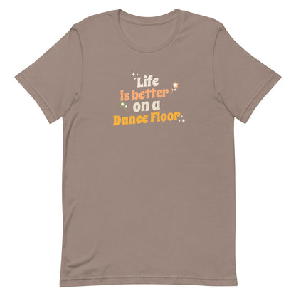 Pebble unisex dance t-shirt with the phrase “Life Is Better on a Dance Floor” in bold, uplifting script. A feel-good design for anyone who finds joy, energy, and belonging through dance.